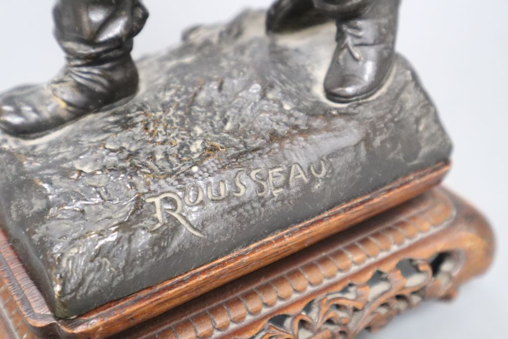 Rousseau. A bronze and ivory figure of a fisherboy, signed, height 26cm
